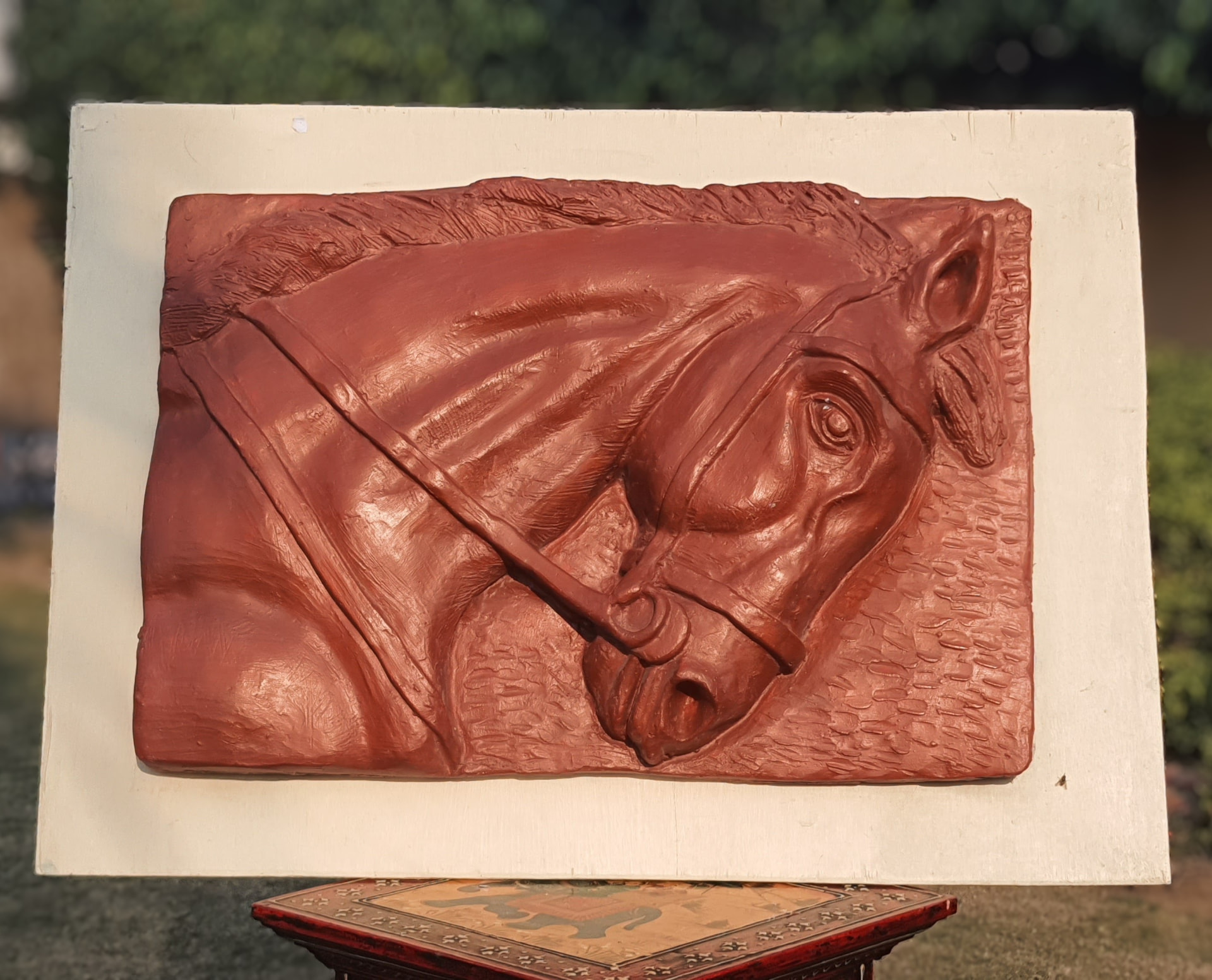 Terracotta relief panel of a bridled horse's head